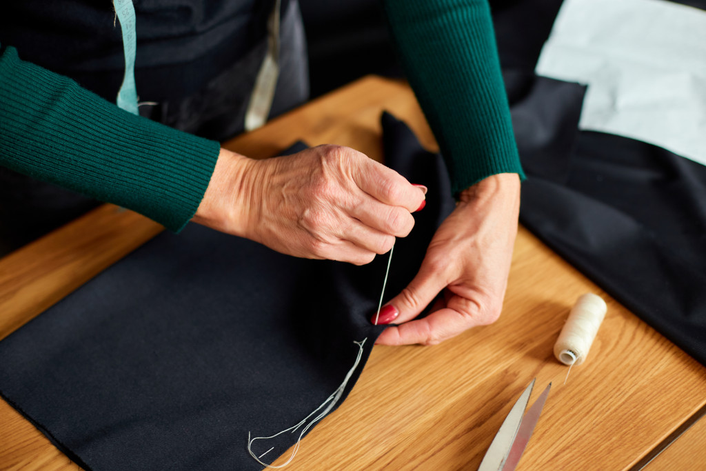 a tailor sewing
